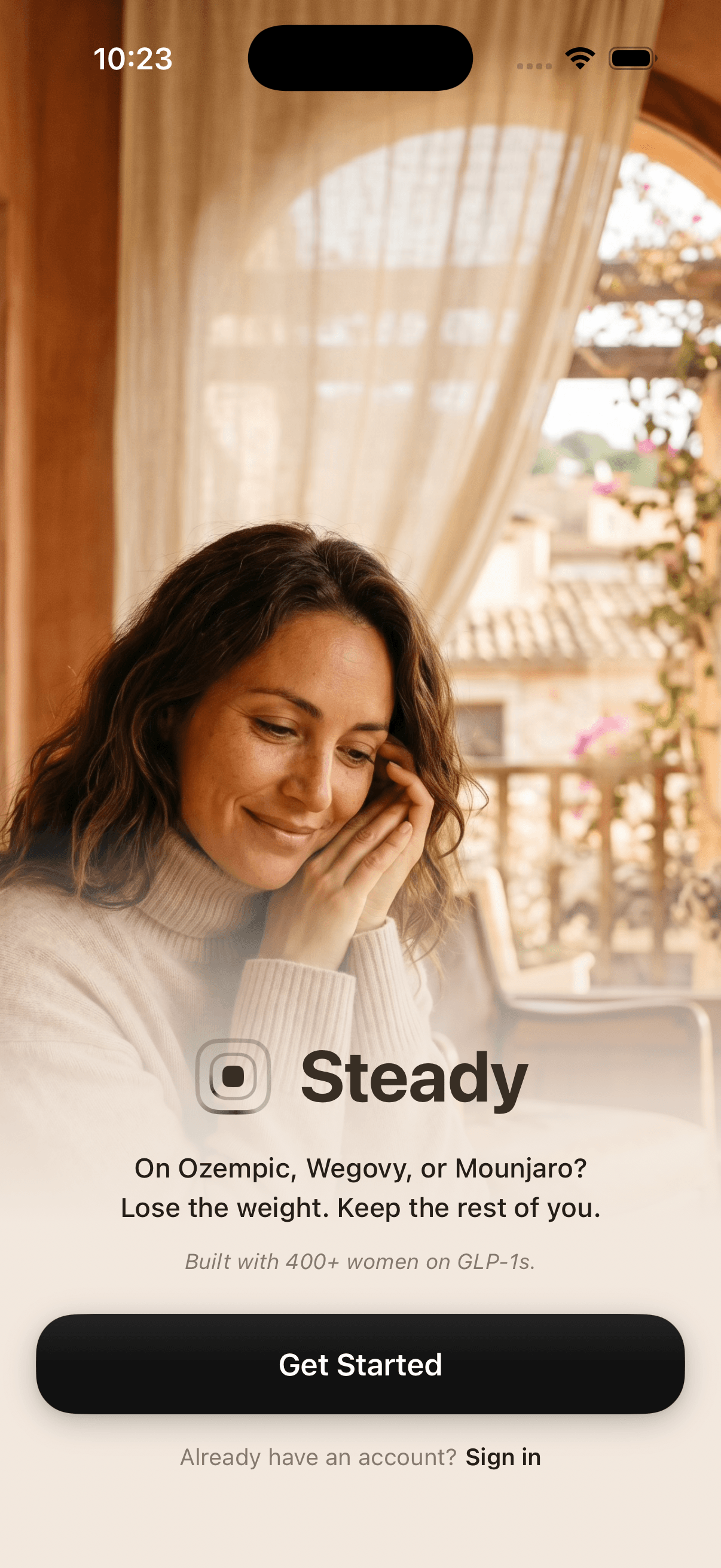 Steady welcome screen — a woman looks out at a warm Mediterranean balcony, under the tagline lose the weight, keep the rest of you.